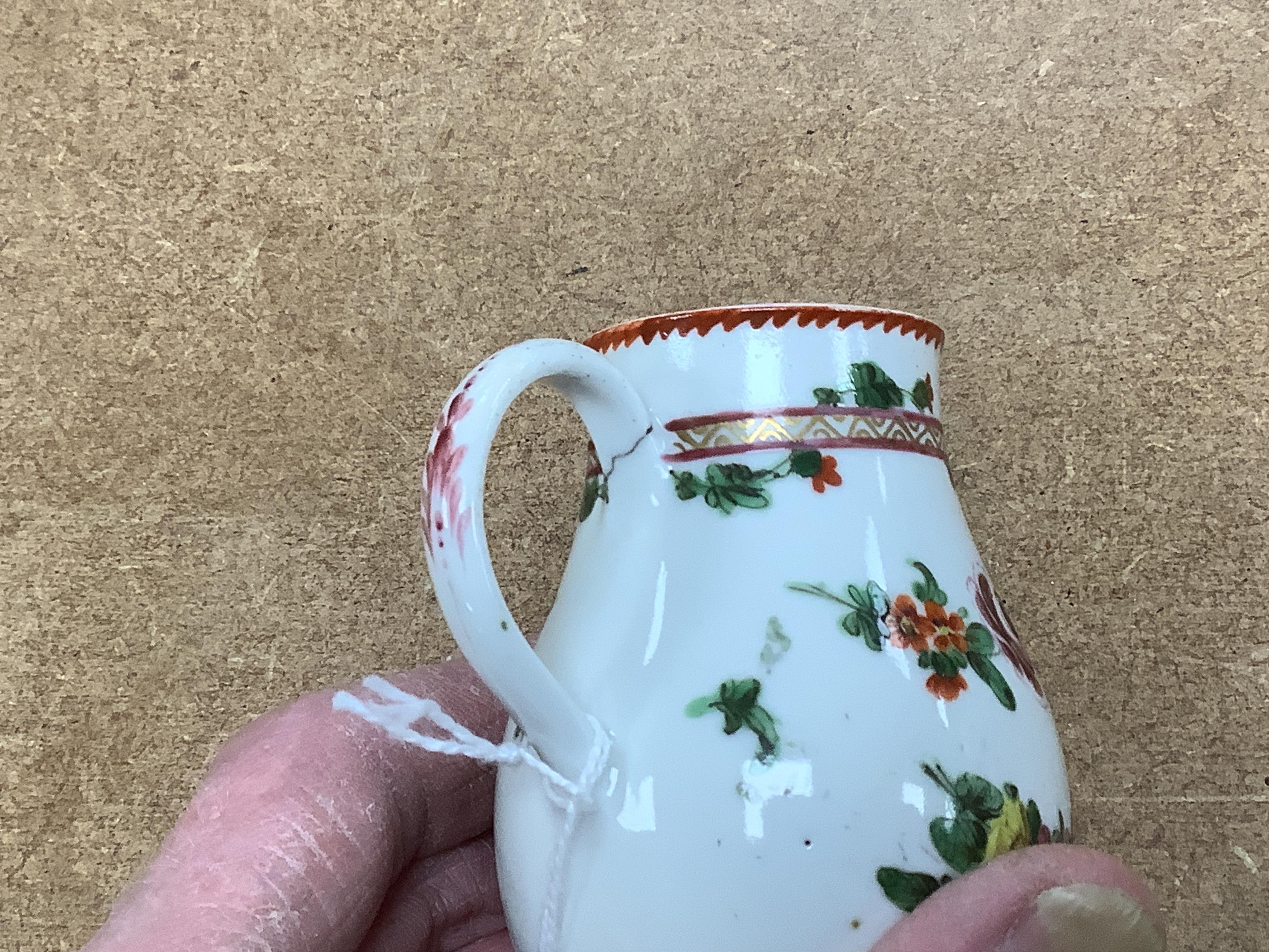 Worcester polychrome tea and coffee wares, c.1760-1780, comprising a tea caddy, a cream jug, five coffee cups and a fluted bowl, the latter with red anchor mark (8), largest tea caddy 14cm high.